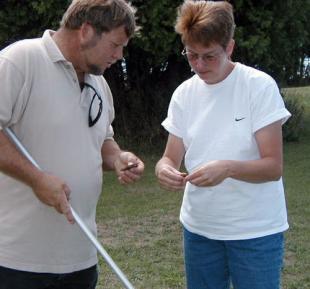 Gina Badgett and a volunteer